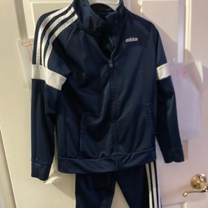 Like new Adidas track suit, worn once! Size 7. Could be for a boy or girl.
